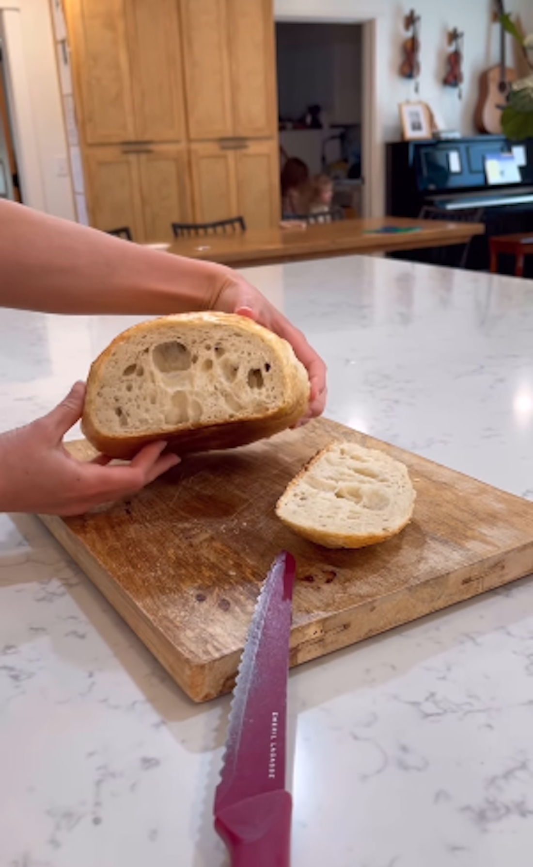 Jessa Seewald cutting sourdough bread
